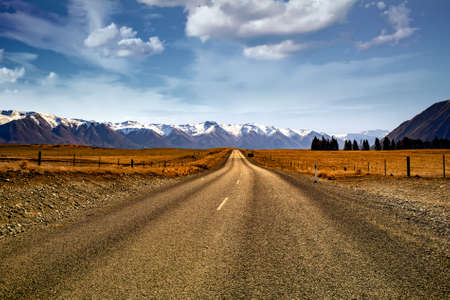 Heading for the snow capped mountains on a long gravel road