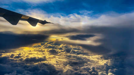 looking down on the clouds from a plane at 40,000 feetの写真素材