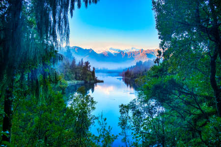 Lake Matheson is one of the most photographed lakes in the world famous for its reflections of the...