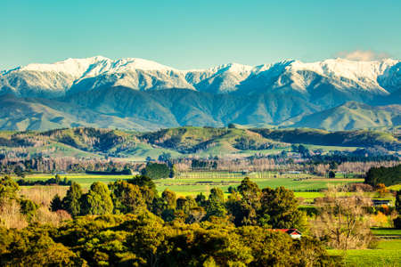 The snow capped Tararua Ranges bordering the beautiful underrated Wairarapa valley taken from Ardslie Landsdownの写真素材