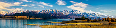 Hayman Rd down a long gravel dirt road on the remote undeveloped northern side of Lake Pukaki on the opposite side of the lake from Mt Cook road on the way to the Aoraki Mount Cookの写真素材