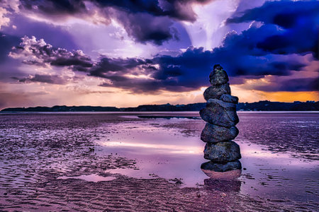Paihia beach rock stack, as the evening closes in  Bay of Islands NZの写真素材