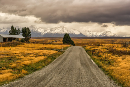 Braemar road Tekapo, heading across country on gravel roads to Mt Cook Station  /and Lake Pukakiの写真素材