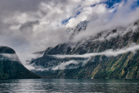The world famous magical Milford Sound in the Fiordland national park  in stormy weatherの写真素材