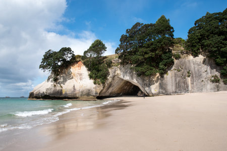 The golden beach and stunning  rock formations and archway  at Cathedral cove in the Coromandel NZの写真素材