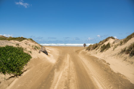 Endless miles of deserted beach with no people at all at Ninety Mile Beach in Northland NZの写真素材