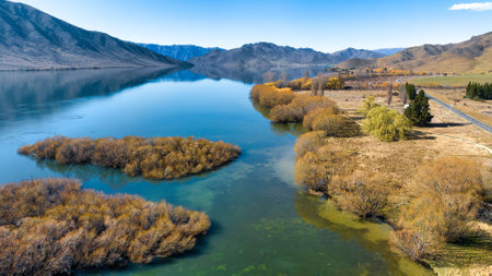 Aerial drone point of view of the mountain ranges  and lakeshore of Lake Benmoreの写真素材