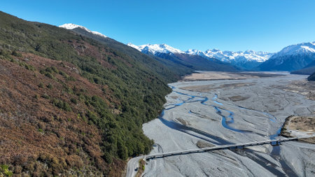 Aerial photography of the braided river with very little water flowing through the alpine Arthurs Passの写真素材
