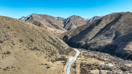 Drone perspective photo of the extreme terrain of the Lindis Pass alpine mountain passの写真素材
