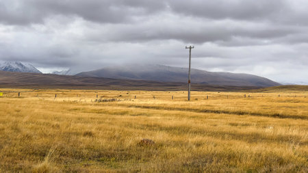 Agricultural farmland and pasture on the gravel road between Lake Tekapo and Lake Pukakiの写真素材