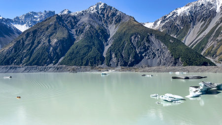 Ice and icebergs floating in the alpine lake in the Tasman valley in Mt Cook National parkの写真素材