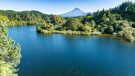 Lake Mangamahoe scenic view with Mount Taranaki in the backgroundの写真素材