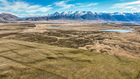 Aerial scenery from a drone over the country road leading to Lake Ohauの写真素材
