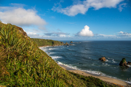 Rugged beach and costal scene on the cliffside walk by the oceanの写真素材
