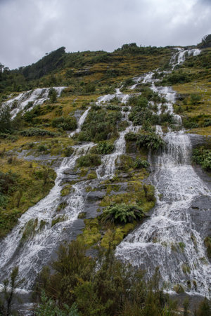 Extreme mountainous terrain, and waterfalls  on the Milford side of the Te Anau Milford roadの写真素材
