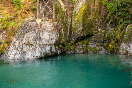 The clear pure turquoise water in the blue springs tourist attraction near Makaroa in Haast Pass en route to the West Coastの写真素材