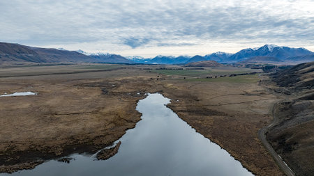 Natural landscape of New Zealand alps and lake with reflection in waterの写真素材