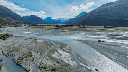 Aerial scene of the braided Dart river flowing between Lake Wakatipu and the Southern alps mountain rangeの写真素材
