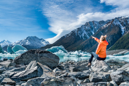 Lone tourist admiring the mountain sceneryの写真素材