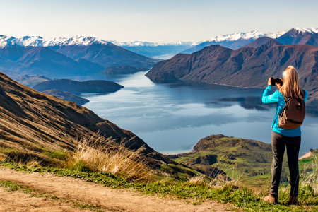 Unrecognisable hiking tourist  at the top of Roys Peakの写真素材