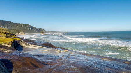 Hiking the short Trueman Track through native forest to a secret beach on the West Coast of the South Island NZの写真素材