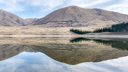 Reflections on Lake Camp one of several lakes in the Ashburton Lakes districtの写真素材