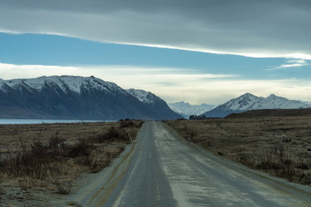 Driving up Lilybank road alongside Lake Tekapo towards the snowy Mount Cook mountain ranges