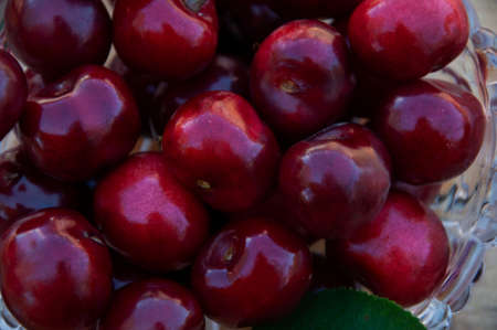 Ripe cherries in a glass vase. High quality photo