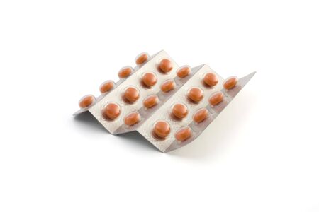 red pills on a white backgroundの写真素材