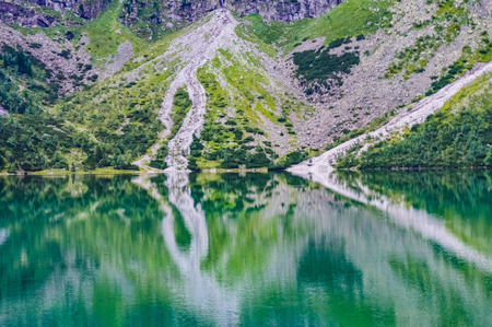 The beautiful lake of Morskie Oko in the Tatra Mountains, near Zakopane, Polandの写真素材