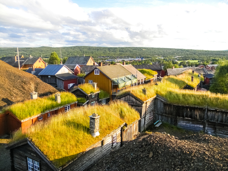Traditional wooden houses with peat on the roof in the village of Roros, Norwayの写真素材
