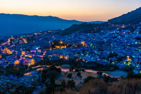 Beautiful sunset over the cityscape of Chefchaouen, the blue city of Moroccoの写真素材