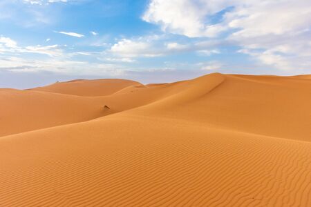 Beautiful landscape of the dunes of the Sahara Desert at dusk, Merzouga, moroccoの写真素材