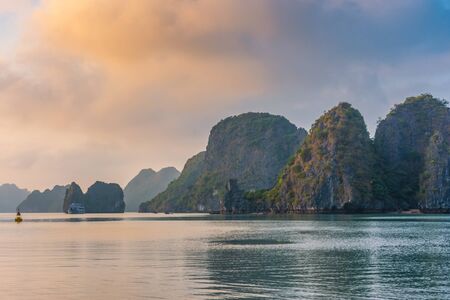 Colorful sunset over Ha Long Bay, Vietnamの写真素材