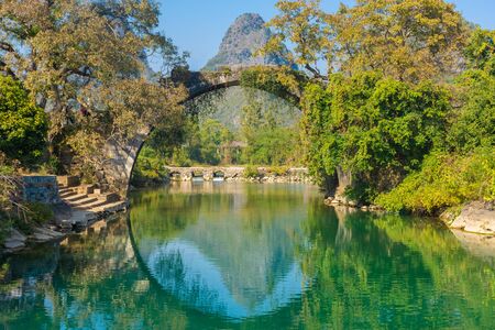The Fuli Bridge on the Yulong River in Yangshuo, Guilin, Chinaの写真素材