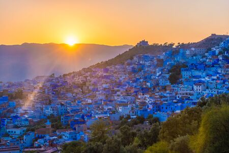 Beautiful sunset over the cityscape of Chefchaouen, the blue city of Moroccoの写真素材