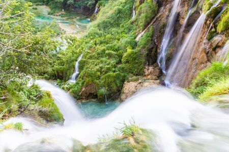 A waterfall flowing in Plitvice Lakes, view from aboveの写真素材
