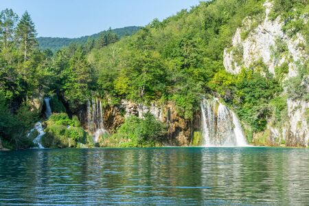 Waterfalls going into the lake, Plitvice, Croatiaの写真素材