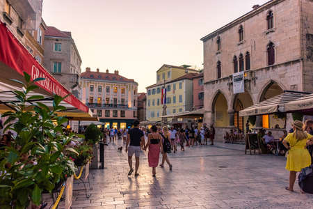 SPLIT, CROATIA, 7 AUGUST 2019: Tourists in the central square of Split at sunsetのeditorial素材