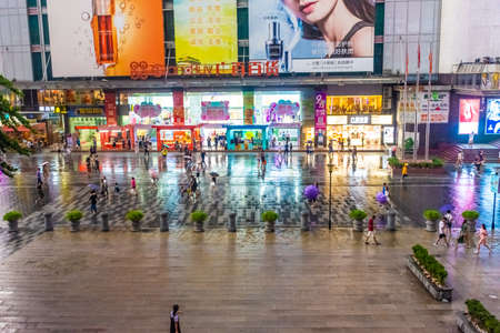 GUANGZHOU, CHINA, 18 NOVEMBER 2019: People in downtown Guangzhouのeditorial素材