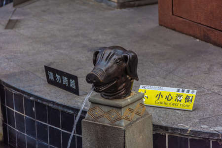 GUANGZHOU, CHINA, 18 NOVEMBER 2019: Pig fountain in the city centerのeditorial素材