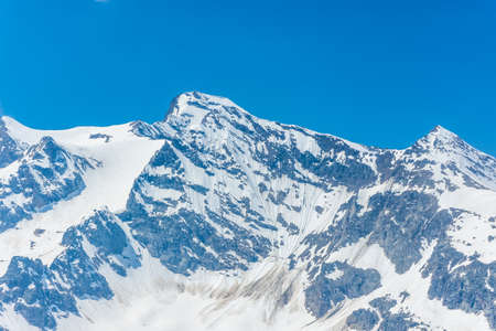 Alpine landscape of the snowy mountains of the border between Italy and France