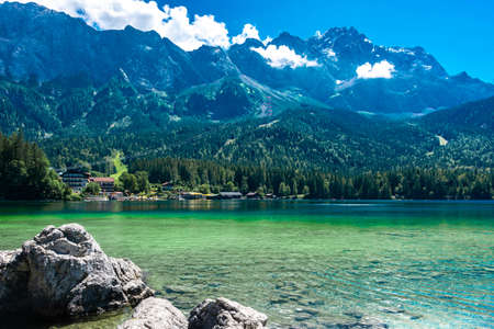Faboulus landscape of Eibsee Lake with turquoise water in front of Zugspitze summit under sunlight. Location: Eibsee lake, Garmisch-Partenkirchen, Bavarian alps, Germany, Europeの写真素材