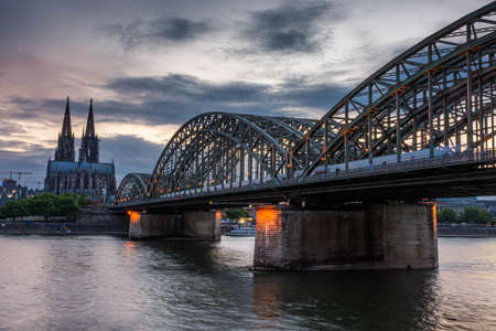 COLOGNE, GERMANY, 23 JULY 2020: Colorful sunset over Cologne Cathedral and Hohenzollern Bridgeのeditorial素材