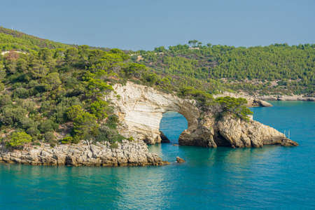 Natural rock arch on the sea in Gargano National Park, Apulia, Italyの写真素材