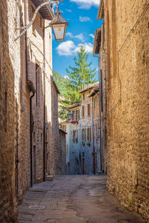 Medieval street in the historic center of Gubbio, town in Umbria, central Italyの写真素材