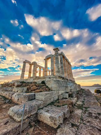 The Temple of Poseidon at Cape Sounion at sunset, over the Aegean Sea in Greeceの写真素材