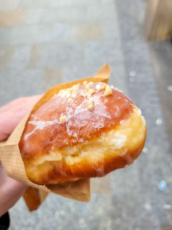 A polish cream donut in the streets of Krakow, Polandの写真素材