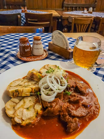 Traditional Slovak Goulash soup with beer, lunch in Bratislava (translation: salt and pepper)の写真素材