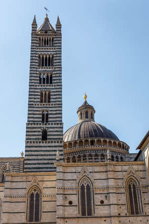 View of the belltower and the dome of Siena Cathedral, Tuscany, Italyの写真素材